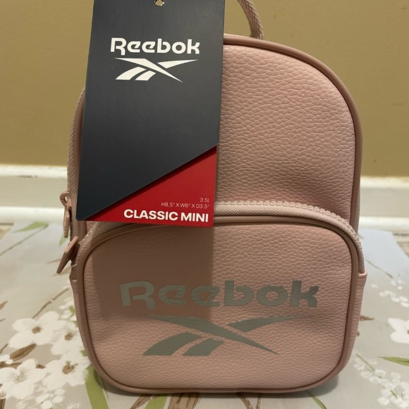 Reebok Handbags - Reebok Ashen Lilac Mini Backpack